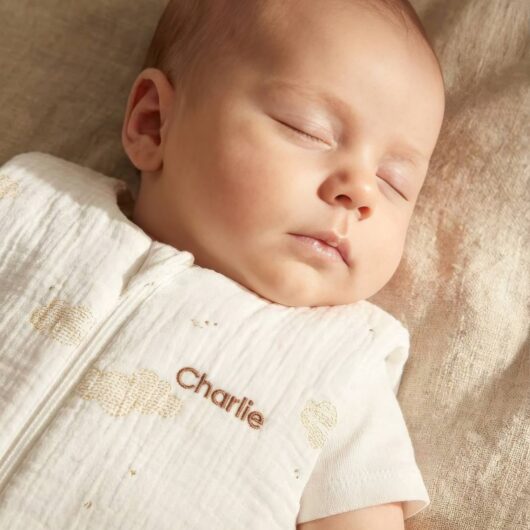 Sleeveless baby sleeping bag with central opening, customisable, IN THE CLOUDS printed white